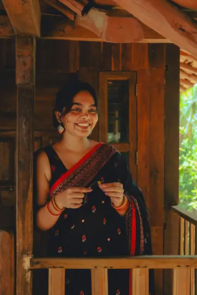 Anjana, IndiCure Health Tours Medical Content Writer, sharing a warm smile in a traditional Indian saree.